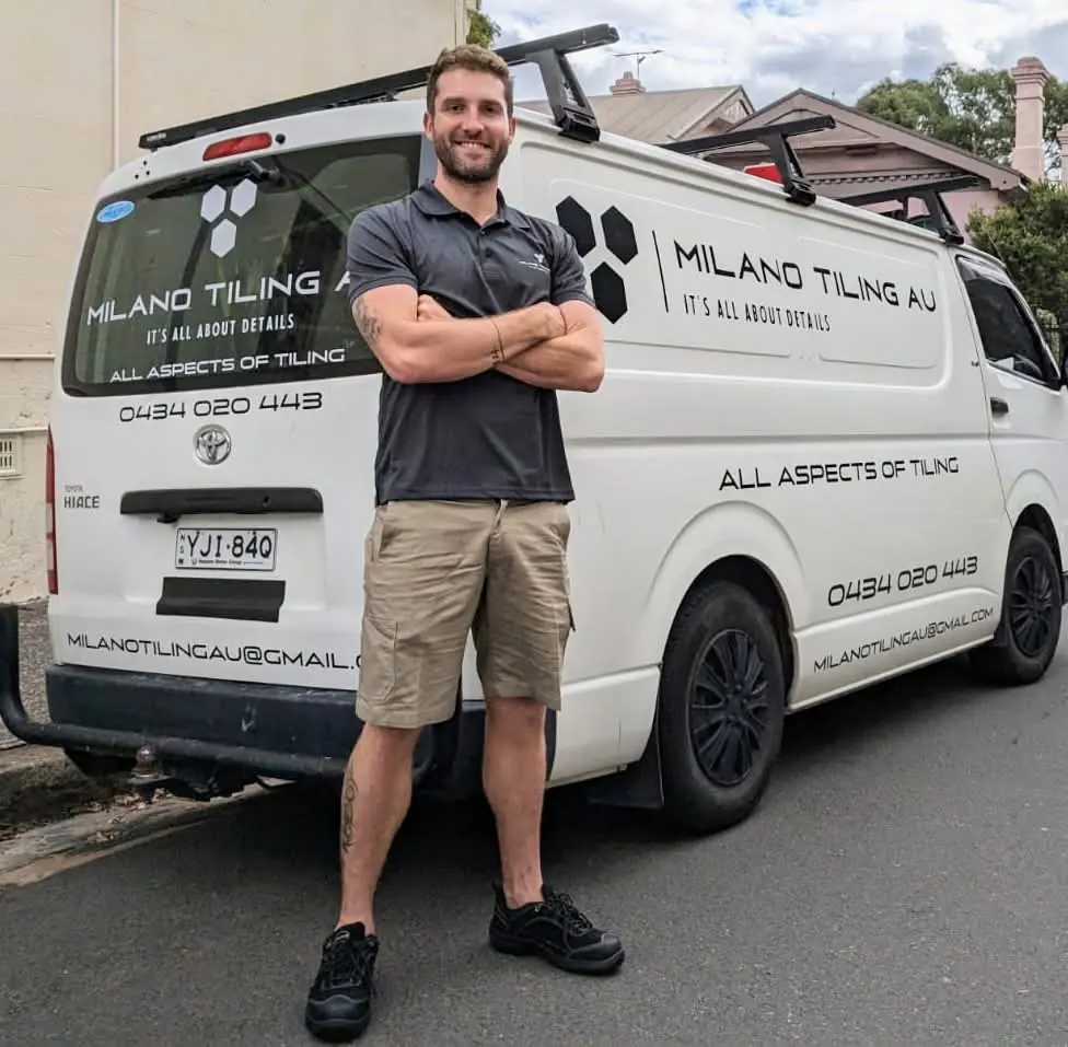 Davide Torriglia standing beside the Milano Tiling & Waterproofing work van in Sydney